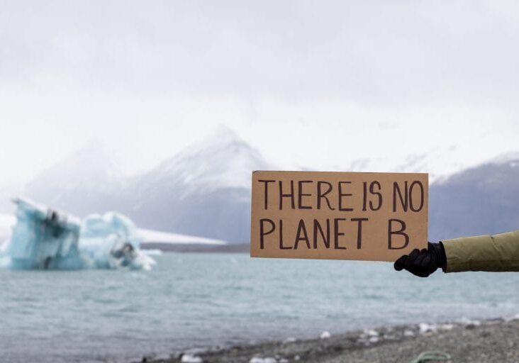 activist-holds-sign-with-important-message-humanity-there-is-no-planet-b